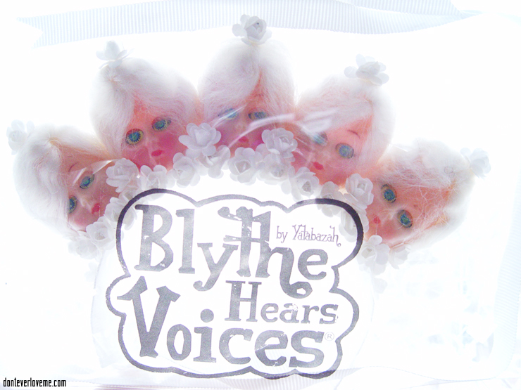 This piece is in all white, with 1940s doll heads and flowers.