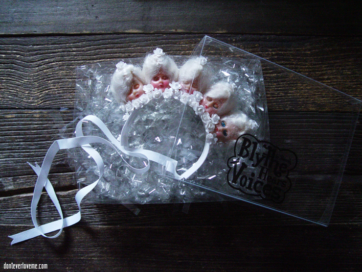 This piece is in all white, with 1940s doll heads and flowers.