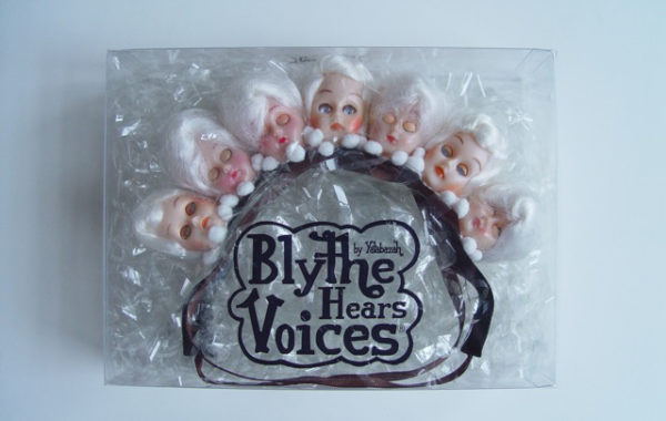 This piece is in all white, with 1940s doll heads and flowers.