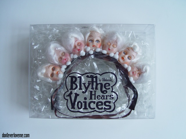 This piece is in all white, with 1940s doll heads and flowers.