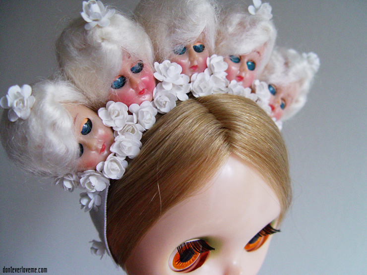 This piece is in all white, with 1940s doll heads and flowers.