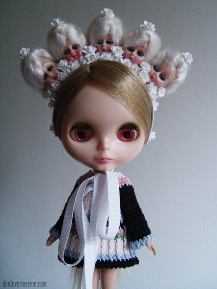 This piece is in all white, with 1940s doll heads and flowers.