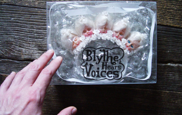 This piece is in all white, with 1940s doll heads and flowers.